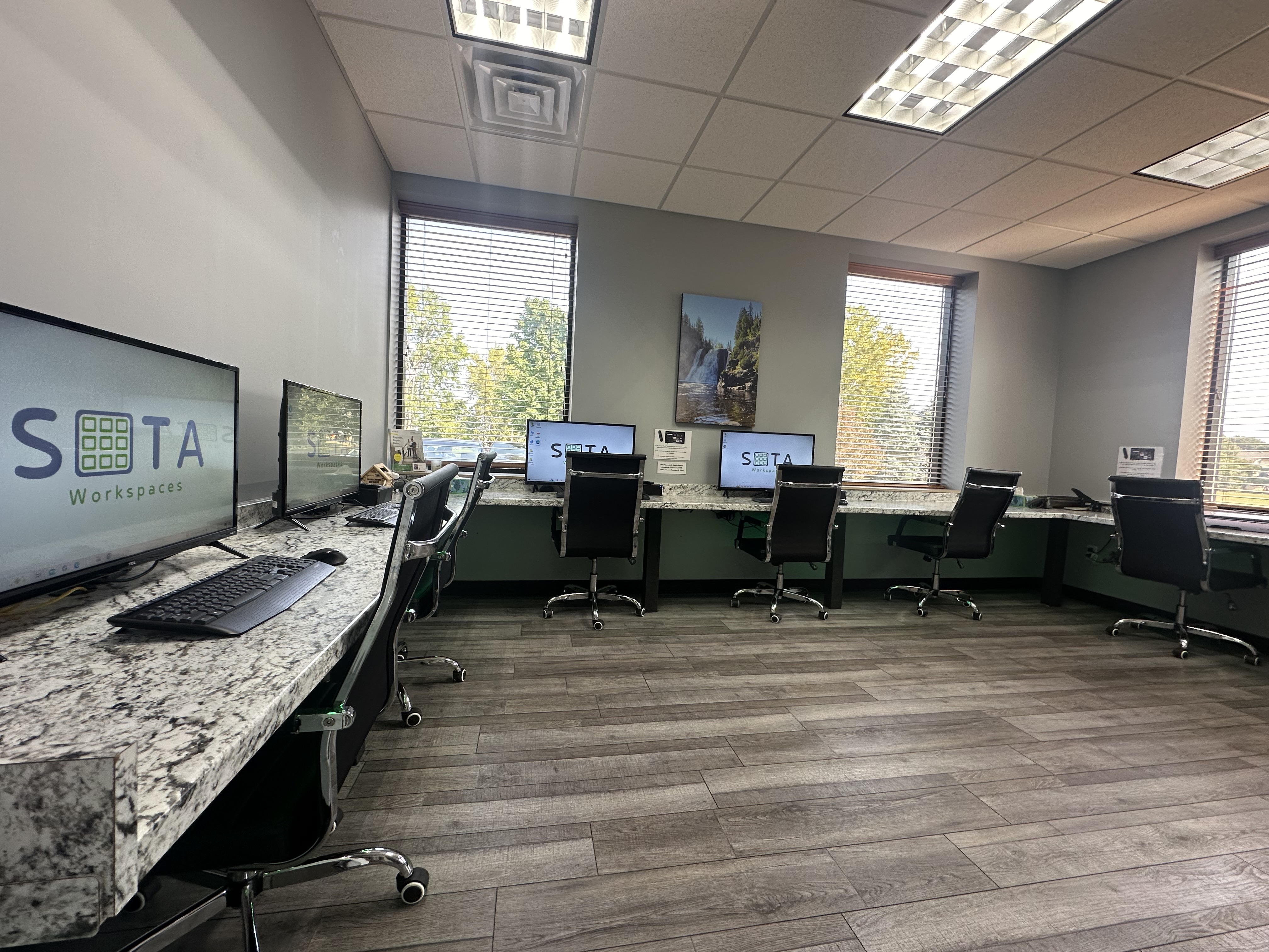 Professionals working at Sota Workspaces coworking space